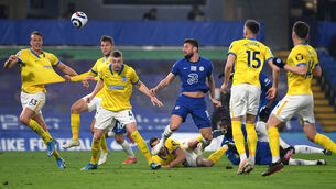 <p>Chelsea's Olivier Giroud has a late headed attempt on goal during the Premier League match at Stamford Bridge</p>