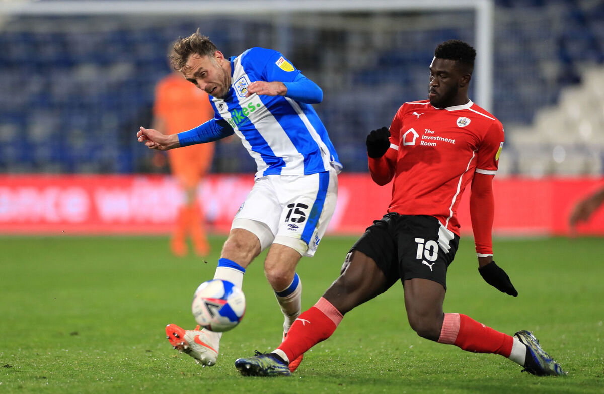 Huddersfield Town's Richard Keogh (left) and Barnsley's Daryl Dike (right) battle for the ball during last week's Sky Bet Championship match. Picture: Mike Egerton