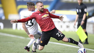 <p>Manchester United's Luke Shaw and Kalvin Phillips of Leeds United battle for the ball at Elland Road. Picture: Peter Powell/PA Wire</p>