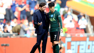 <p>Tottenham Hotspur interim manager Ryan Mason (left) speaks to Son Heung-min during the Carabao Cup final.</p>