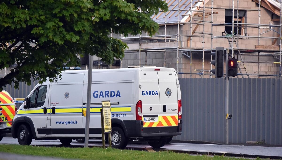 Gardaí at the scene yesterday evening in Rochestown, Cork, after a shot was fired. Five people were arrested. Picture: Eddie O'Hare