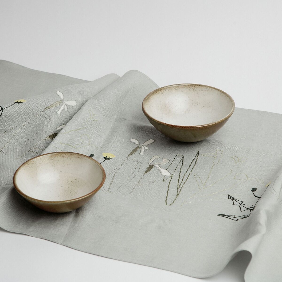  Jennifer Slattery's Herbarium Irish linen table runner with hand embroidery is inspired by the Botanical Gardens and can be matched with six napkins (runner €95, napkins €120).