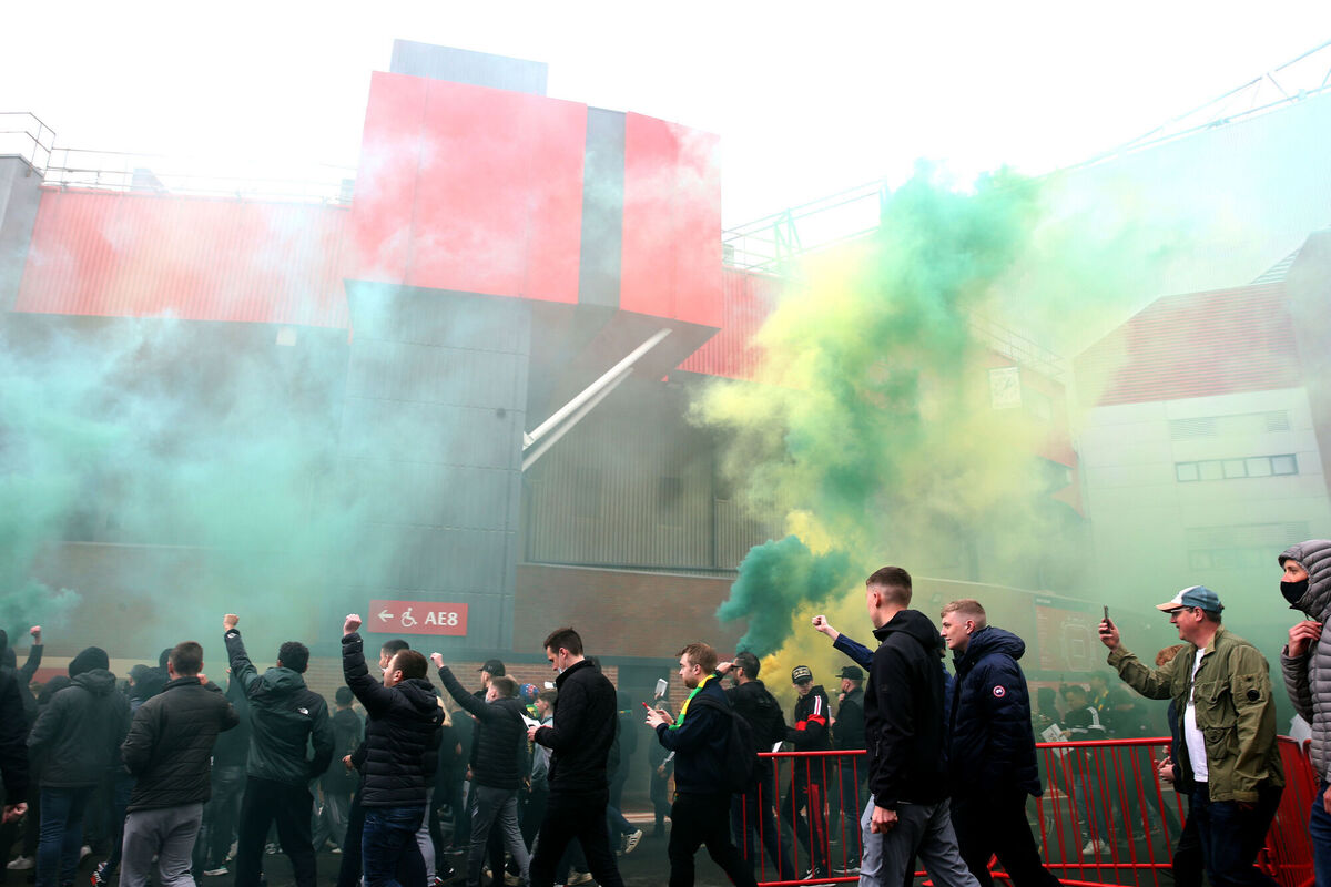 Fans make their way into the ground as they protest against the Glazer family. Picture: Barrington Coombs