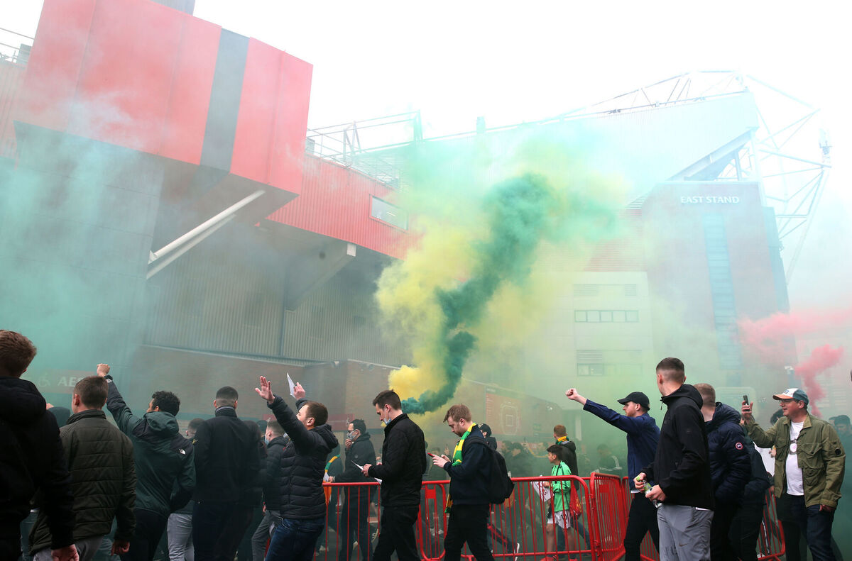 Fans make their way into the ground as they protest against the Glazer family