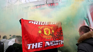<p>A fan holds up a banner as they protest against the Glazer family, owners of Manchester United. Picture: Barrington Coombs/PA Wire.</p>