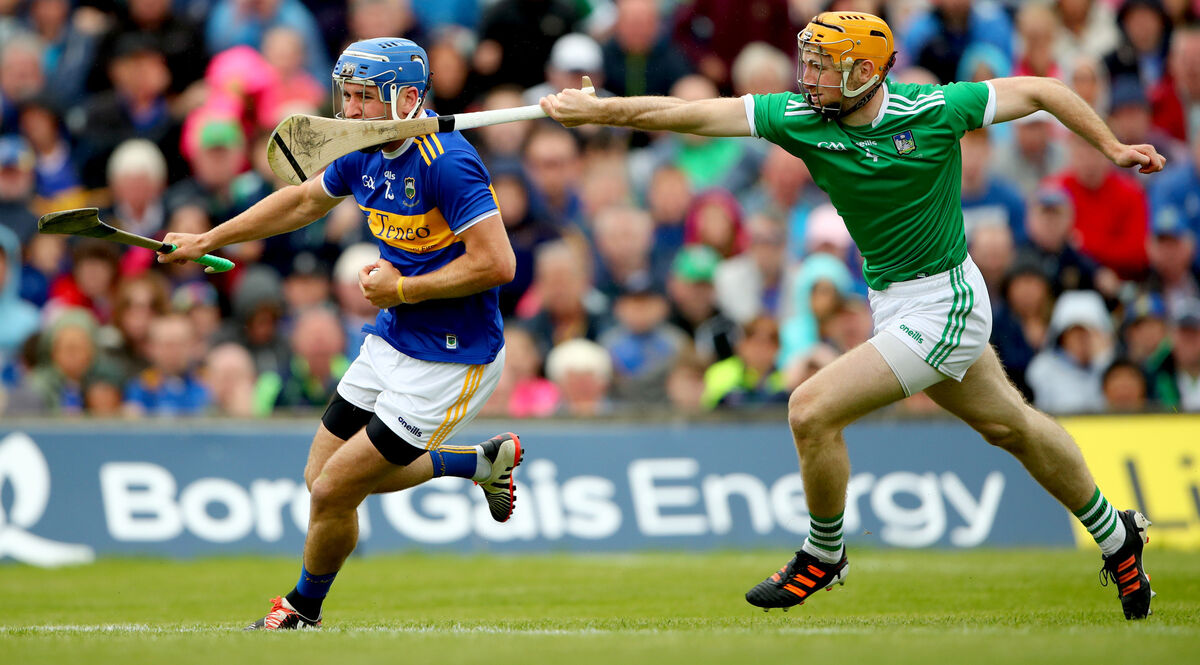 Limerick's Richie English up against John McGrath of Tipperary. Picture: INPHO/James Crombie