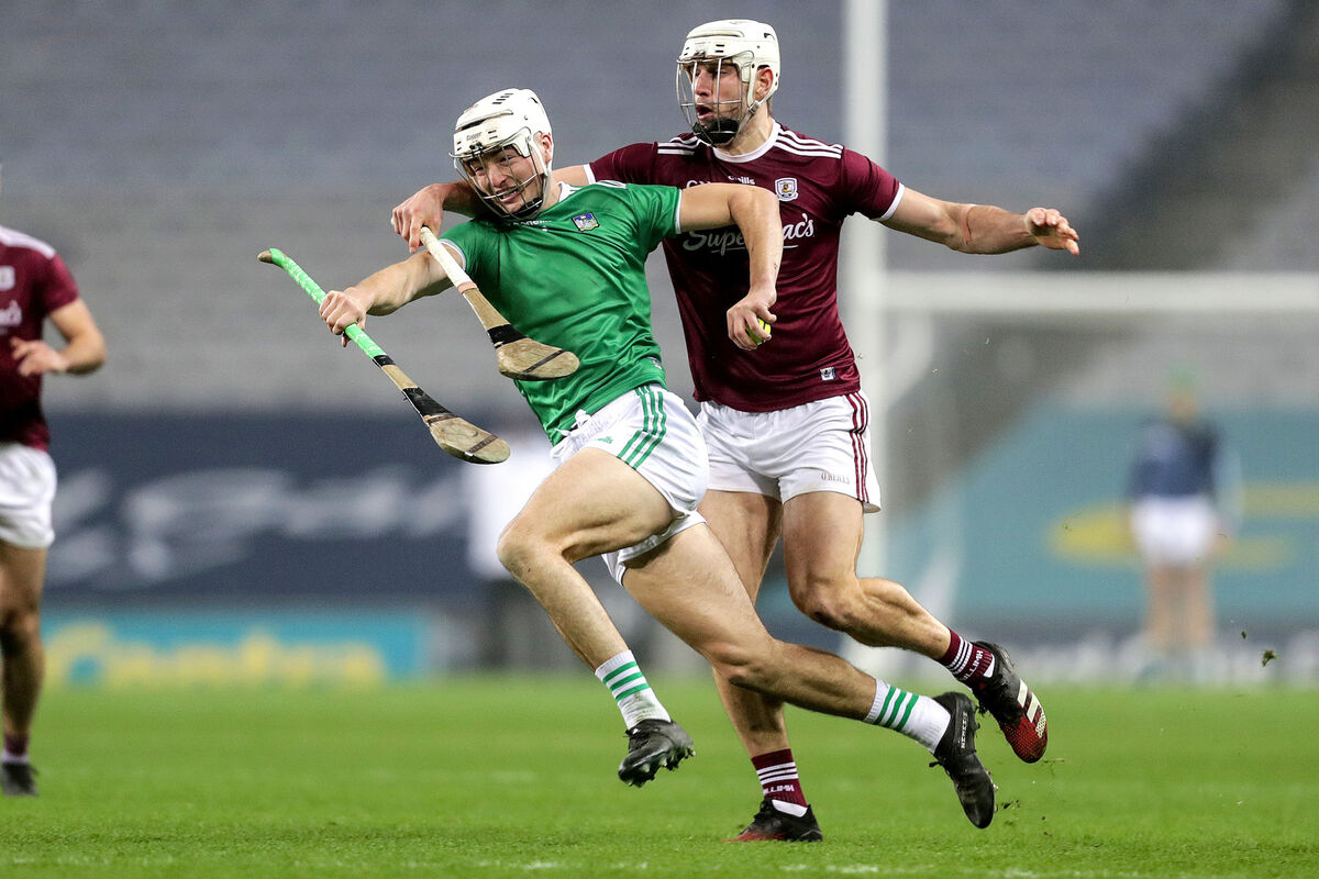Limerick's Kyle Hayes goes by Gearoid McInerney of Galway. Picture: INPHO/Laszlo Geczo
