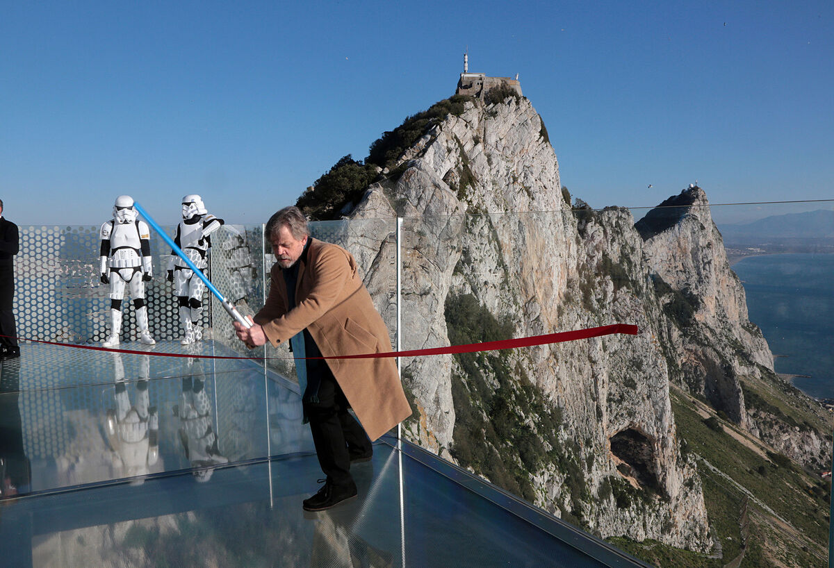 Star Wars actor Mark Hamill 'cutting' the red ribbon with a 'lightsaber' as he opens the Gibraltar Skywalk on the Rock of Gibraltar. 