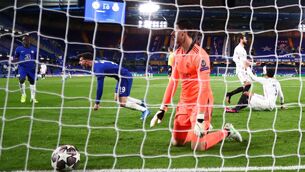 <p>Chelsea's Mason Mount celebrates after scoring their second goal as Real Madrid goalkeeper Thibaut Courtois looks dejected. Picture: Clive Rose/Getty Images</p>