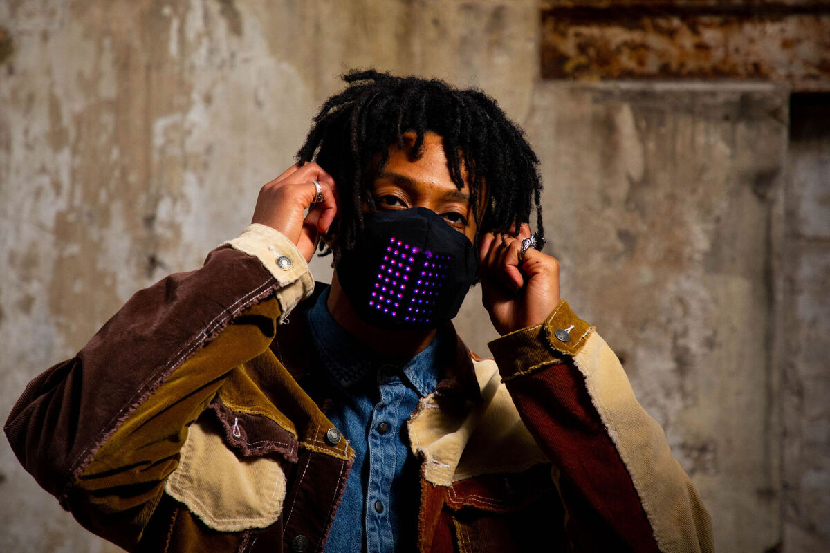 Karim from London wears a limited edition interactive LED face mask ahead of The BRIT Awards. The mask has been created by headline sponsor, Mastercard using new, first of its kind technology, that allows integrated LED panels to illuminate and react in response to speech, music and environmental sounds. The masks, which can be connected to the wearers smart phone via Bluetooth technology feature 8x8 micro-LED lights with 64 pixels that react to sound. Picture: David Parry/PA Wire