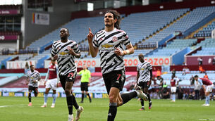 <p>Edinson Cavani celebrates scoring United’s third goal (Shaun Botterill/PA)</p>