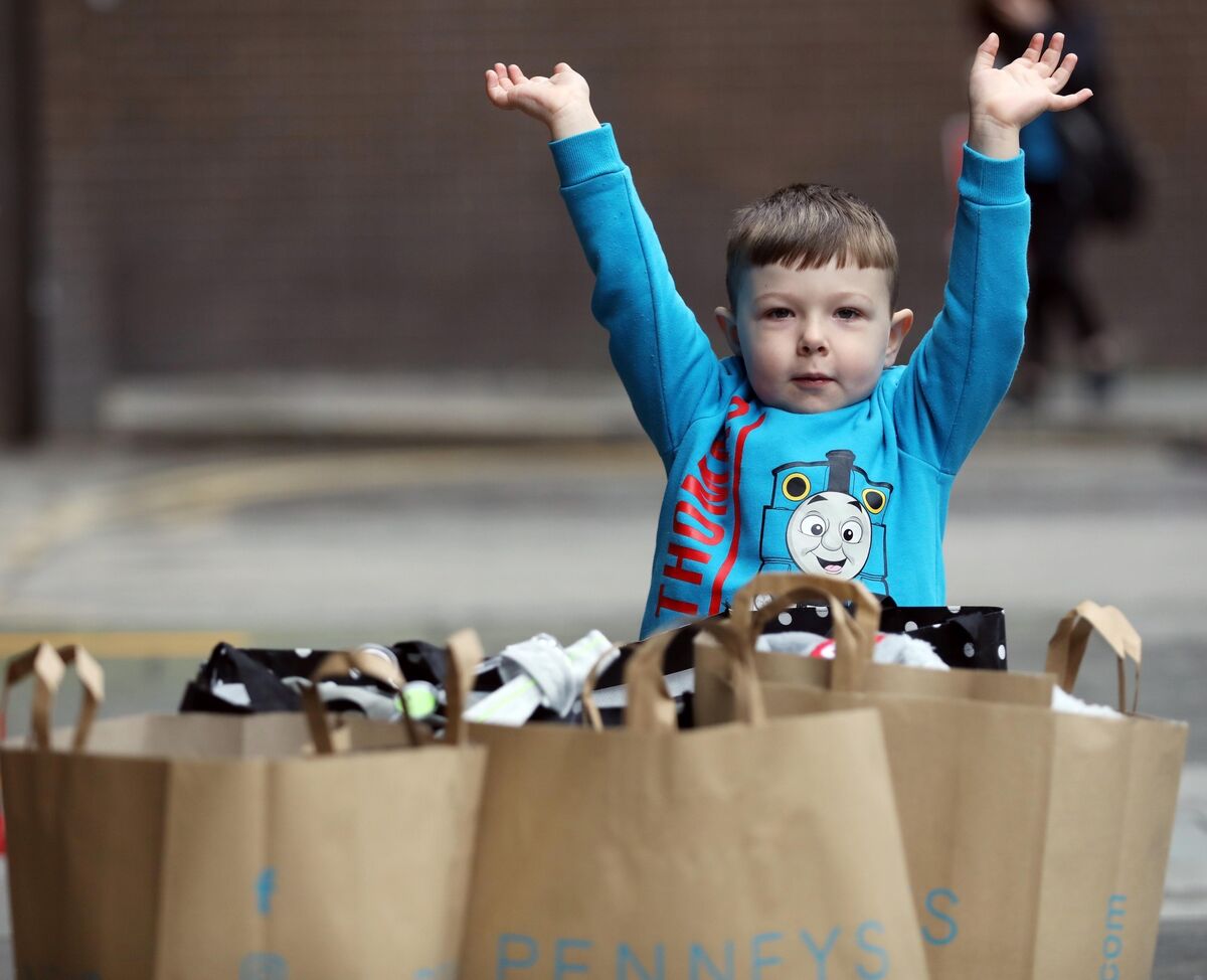 Frankie Gorman, aged 4, from Finglas with shopping bags outside Penneys on O'Connell Street Dublin on Monday. Picture: Leah Farrell/RollingNews.ie Frankie Gorman, aged 4, from Finglas with shopping bags outside Penneys on O'Connell Street Dublin on Monday. Picture: Leah Farrell/RollingNews.ie