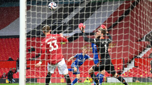 <p>Leicester City's Luke Thomas (centre) scores against Manchester United at Old Trafford. Picture: Michael Regan/PA</p>