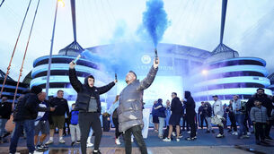 <p>Manchester City supporters celebrate outside the Etihad Stadium. (AP Photo/Jon Super)</p>