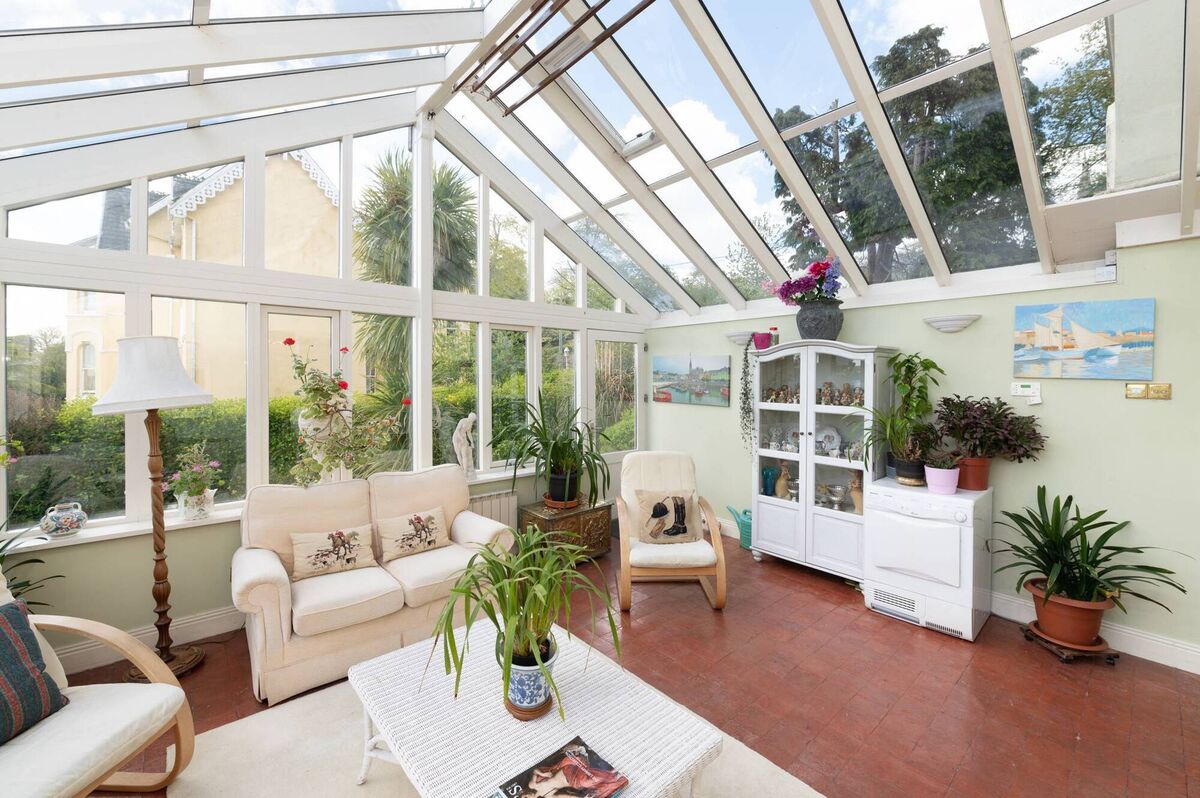 Sunroom is double glazed, in painted hardwood frames with anti-glare glass Sunroom is double glazed, in painted hardwood frames with anti-glare glass