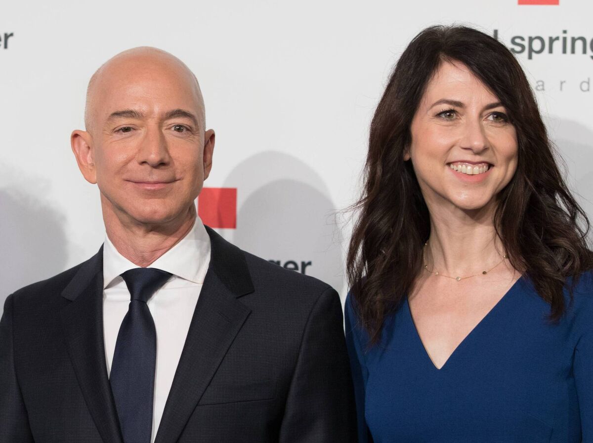 Amazon CEO Jeff Bezos and his wife MacKenzie Bezos poses as they arrive at the headquarters of publisher Axel-Springer where he will receive the Axel Springer Award 2018 on April 24, 2018 in Berlin. Amazon CEO Jeff Bezos and his wife MacKenzie Bezos poses as they arrive at the headquarters of publisher Axel-Springer where he will receive the Axel Springer Award 2018 on April 24, 2018 in Berlin.