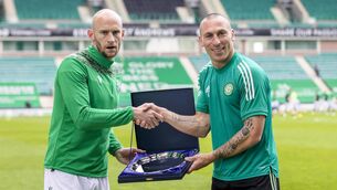 <p>Hibernian's David Gray (left) presents Celtic's Scott Brown with an award to commemorate his 14 year career at Celtic ahead of the Scottish Premiership match at Easter Road,</p>