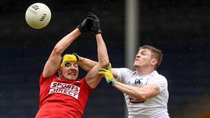 <p>
                <span class="contextmenu emphasis">MY BALL:</span> Cork's Paul Walsh and Kildare's Kevin Feely battle for possession.</p>