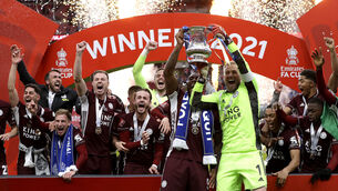 <p>WEMBLEY WONDERS: Leicester City veteran Wes Morgan, left, and goalkeeper Kasper Schmeichel lift the FA Cup together as the Foxes celebrate Saturday’s victory over Chelsea at Wembley. Leicester are a club in perfect synergy. 	<span class="contextmenu emphasis CaptionCredit">Picture: Kirsty Wigglesworth/PA</span>
            </p>