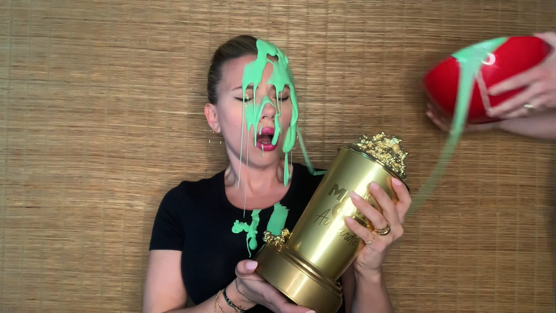 Scarlett Johansson gets covered in slime by husband Colin Jost during MTV awards