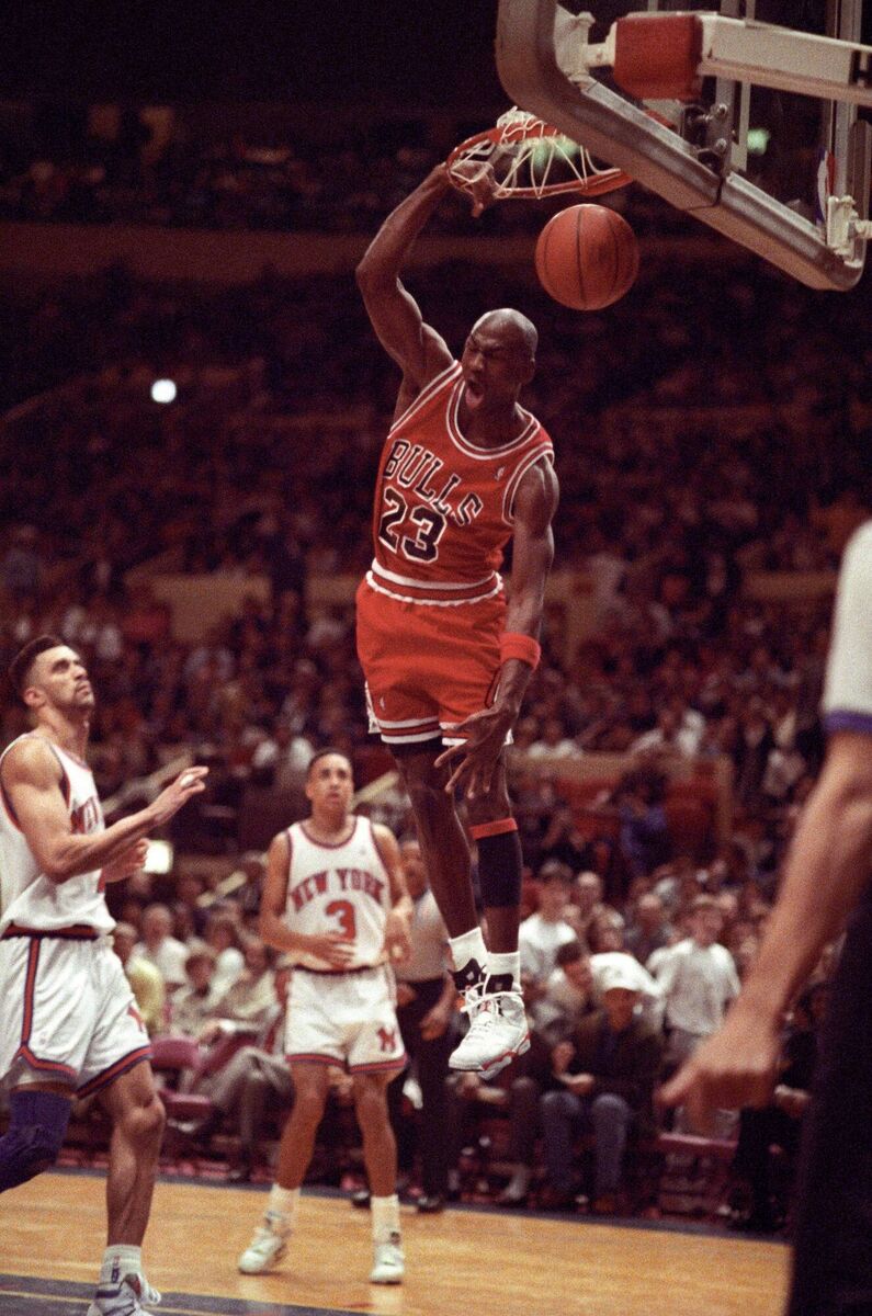 Michael Jordan of the Chicago Bulls dunking in a basketball game against the New York Knicks, 1991 - Jordan's otherworldly ability helped propel the rise of Nike's Air sneakers. Pic: Alamy/PA.