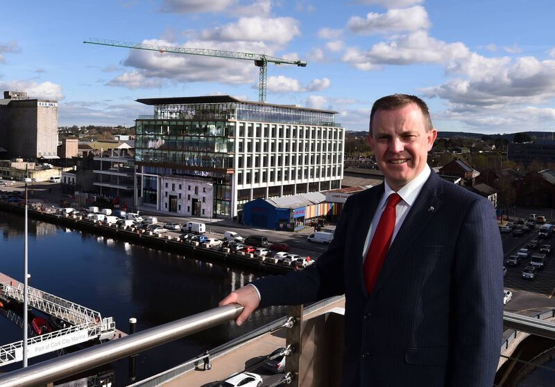 Navigation Square developer Brian O'Callaghan pictured with NSQ1 behind him, in 2019