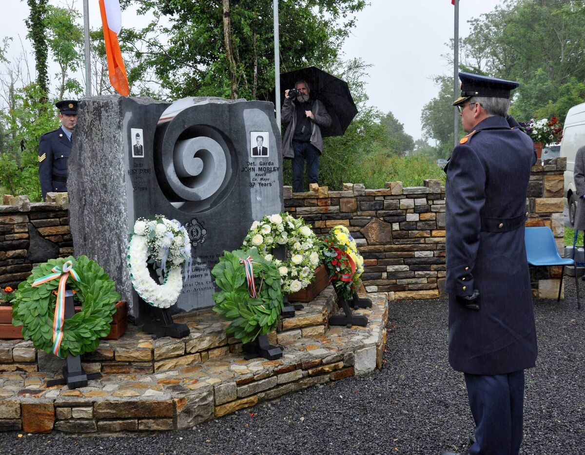Garda Commissioner Drew Harris salutes at the memorial to Detective Garda John Morley and Garda Henry Byrne at Shannon’s Cross,Loughglynn. Picture: Liam Reynolds
Garda Commissioner Drew Harris salutes at the memorial to Detective Garda John Morley and Garda Henry Byrne at Shannon’s Cross,Loughglynn. Picture: Liam Reynolds