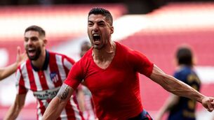 <p>Luiz Suarez celebrates his winner against Osasuna</p>