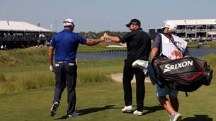 <p>Padraig Harrington and Shane Lowry fist bump after Harrington played his tee shot on the 17th hole at Kiawah Island. (Photo by Jamie Squire/Getty Images)</p>