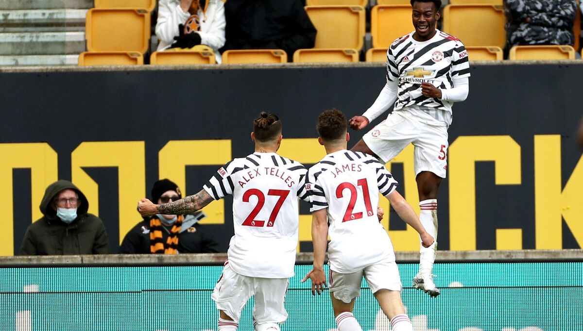 STARLET: Manchester United's Anthony Elanga celebrates with his team-mates after scoring the opener in Sunday's win at Molineux.