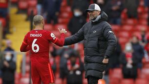 <p>HAPPY KLOPPY: Liverpool's Thiago Alcantara with his manager Jurgen Klopp, celebrating their late surge which secured Champions League football for next season. </p>