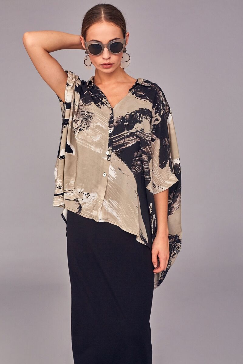 Naya print oversized shirt €160 worn over sleeveless dress €70 Naya print oversized shirt €160 worn over sleeveless dress €70