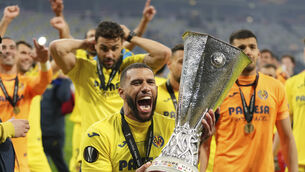 <p>Villareal’s Etienne Capoue holds the Europa League trophy (Michael Sohn/AP)</p>