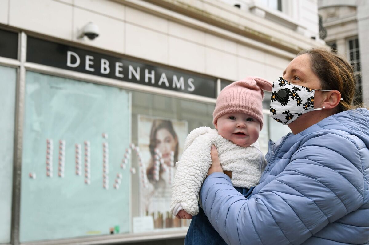 Claire O'Leary, one of the ex-Debenhams workers, pictured with her daughter Grace, who was born in November, outside the former Debenhams store on St. Patrick's St at the end of their 406-day struggle for justice. Picture: Denis Minihane.