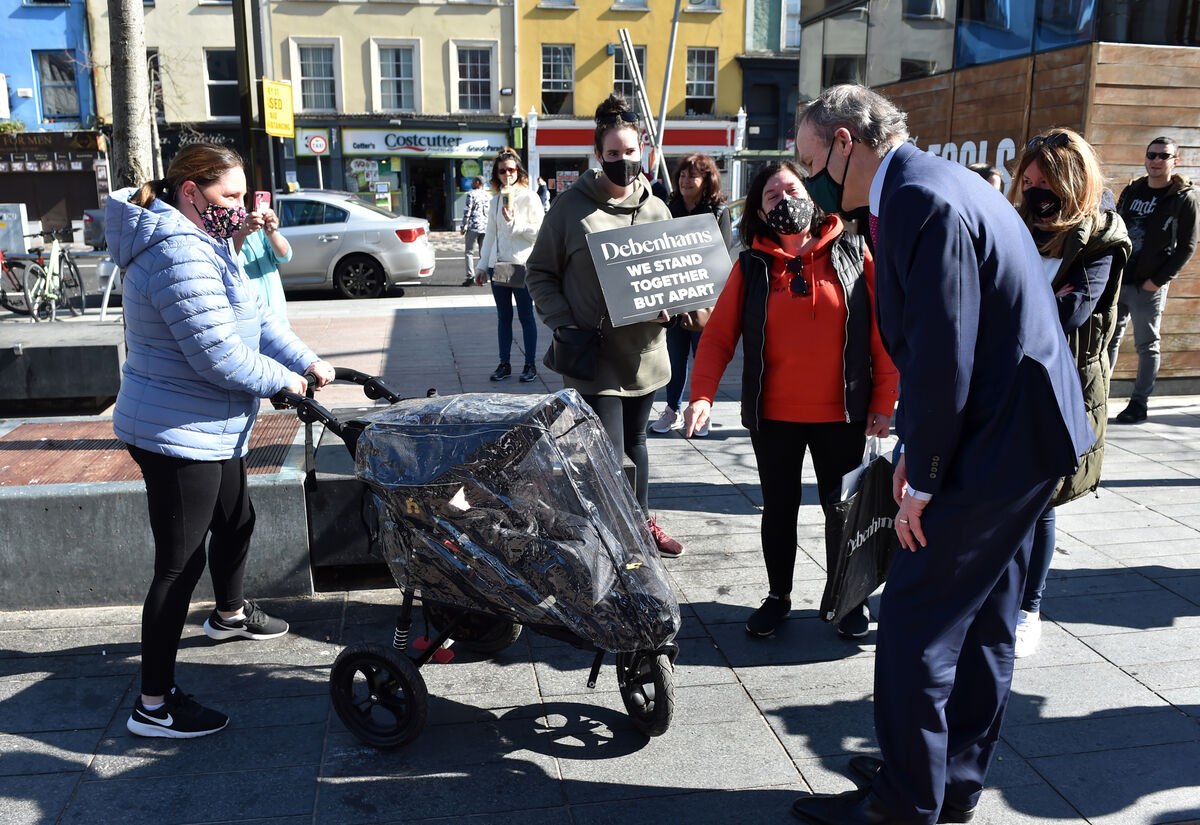An Taoiseach Michéal Martin chatting with Debenhams workers Madeline Whelan, Valerie Conlon, Claire O'Leary and her 18-week baby Grace last March. Picture: Eddie O'Hare