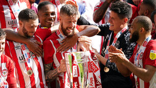<p>Brentford's Pontus Jansson with the trophy as they celebrate promotion to the Premier League. Picture: Mike Egerton/PA Wire.</p>