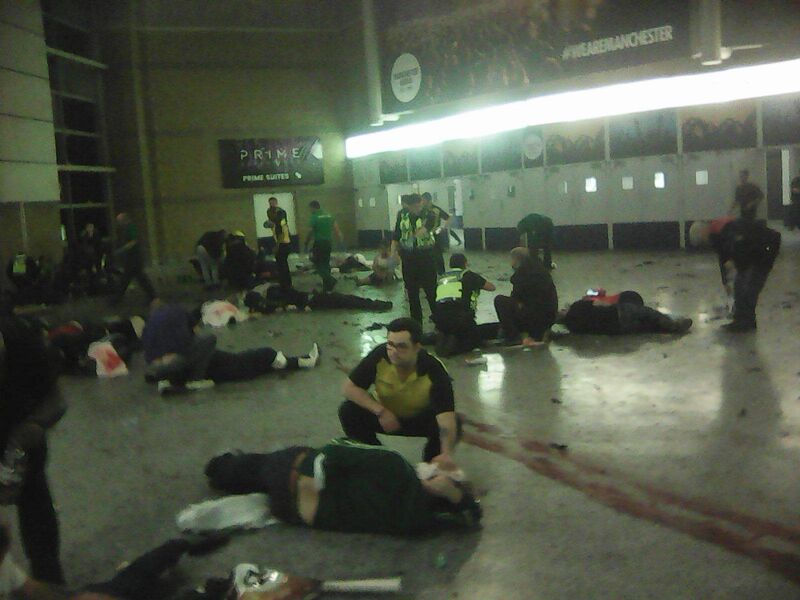 Helpers attend to people inside the Manchester Arena. Picture: PA Wire