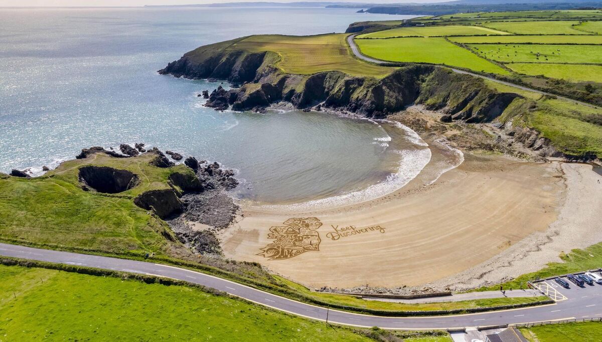 The aerial photography of a bespoke piece of sand artwork commissioned as part of a Fáilte Ireland ‘Keep Discovering’ campaign encourages the public to explore every corner of  Ireland this summer. Picture: aerial.ie via Andres Poveda Photography The aerial photography of a bespoke piece of sand artwork commissioned as part of a Fáilte Ireland ‘Keep Discovering’ campaign encourages the public to explore every corner of  Ireland this summer. Picture: aerial.ie via Andres Poveda Photography