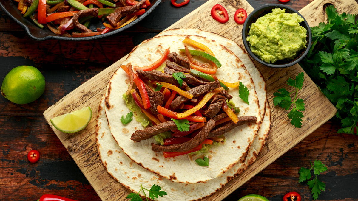 Beef fajitas with tomato and coriander salsa and guacamole