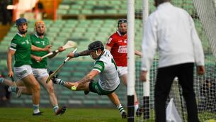 <p>5 June 2021; Limerick goalkeeper Barry Hennessy is beaten by Cork's Jack O'Connor for a goal during the Allianz Hurling League Division 1 Group A Round 4 match between Limerick and Cork at LIT Gaelic Grounds in Limerick. Photo by Ray McManus/Sportsfile</p>