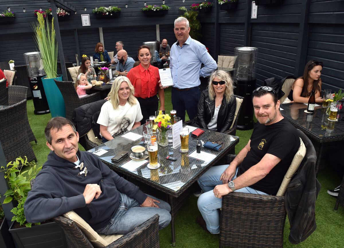 Leo Brennan, proprietor and Joanne O'Leary, manager, welcome back customers Mark and Brigid Littlejohns and Ian and Jeannette Field for food and drink at District 11 bar and restaurant in Glanmire. Photo: Eddie O'Hare