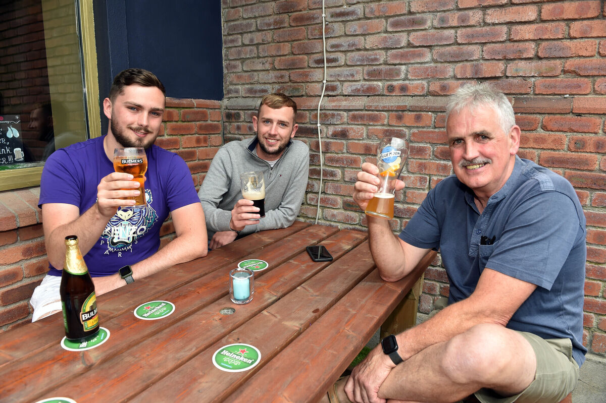 Colman Moloney and his sons Jack and Gavin from Glanmire enjoying a drink at District 11 bar and restaurant in Glanmire. Photo: Eddie O'Hare