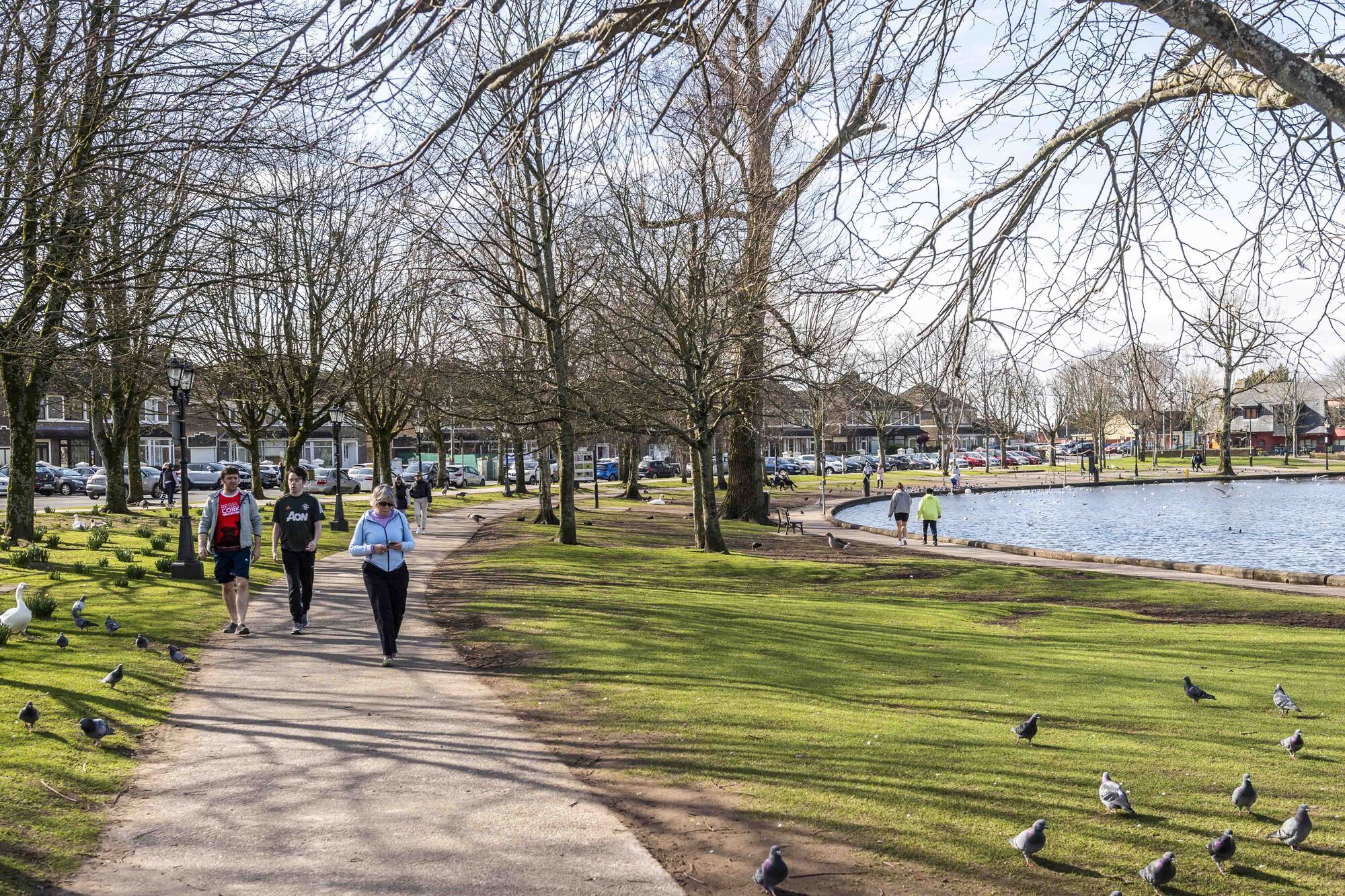  Walkers enjoying the fine weather near The Lough in Cork city. File Picture: Andy Gibson.