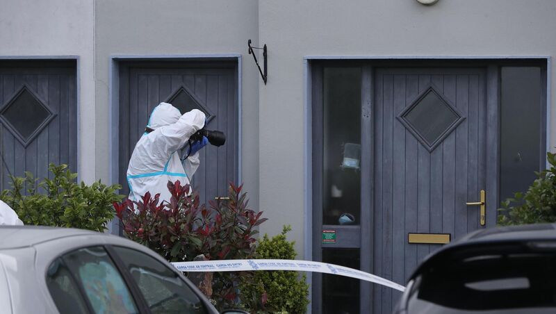 A Garda forensics officer at the house in Clashmore, Co Waterford. Picture: Niall Carson/PA Wire