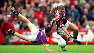 <p>BACK IN THE DAY: Westmeath's Cathal Keane and Wexford's David Murphy battle for possesion in their qualifier clash in 2001, the first ever year of football qualifiers. 	Picture: Ray McManus/Sportsfile</p>