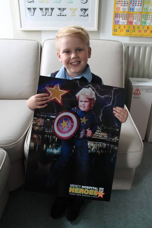 Callum McCarthy shows the Mercy Hospital Heroes poster he posed for Callum McCarthy shows the Mercy Hospital Heroes poster he posed for