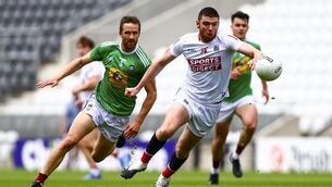 <p>
                <span class="contextmenu emphasis">POWERING ON:</span> Cork's Luke Connolly evades Kevin Maguire of Westmeath in this afternoon's Allianz Football League Division Two relegation play-off</p>