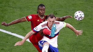 <p>Belgium's Dedryck Boyata challenges Russia's Artem Dzyuba at the Saint Petersburg stadium. (Anton Vaganov/Pool via AP)</p>