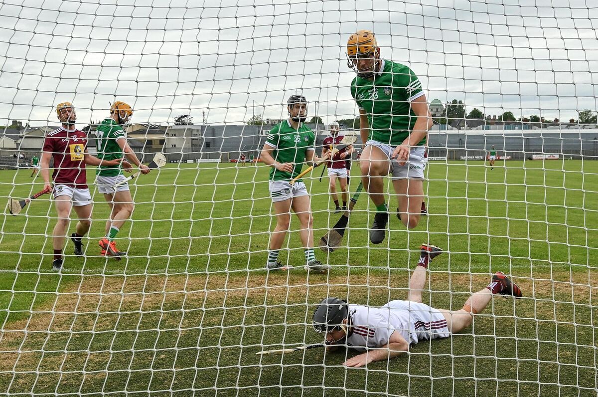 Darren O'Connell of Limerick skips over Westmeath goalkeeper Noel Conaty after scoring his side's second goal. Picture: Seb Daly/Sportsfile