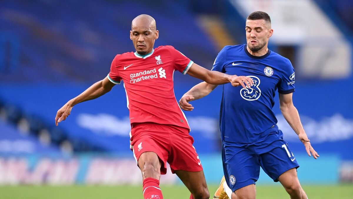 GERMAN MIND GAMES: Fabinho of Liverpool is challenged by Chelsea's Mateo Kovacic last September. German bosses Thomas Tuchel and Jurgen Klopp will relish pittintg their wits against each other on August 28th and on New Year's Day. 